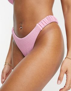 Oferta de River Island print scrunchie detail bikini bottom in pink por $18 en ASOS